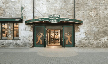 Entrance to the Jameson Distillery Bow St. in Dublin with green signage.