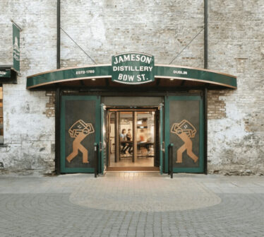 Entrance to the Jameson Distillery Bow St. in Dublin with green signage.