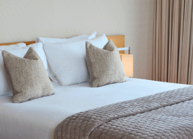 Elegant hotel room with plush pillows and quilted bedding at Louis Fitzgerald Hotel, Dublin.