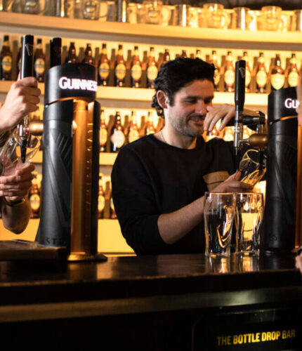 Guests enjoying drinks at the bar in Louis Fitzgerald Hotel, Dublin.