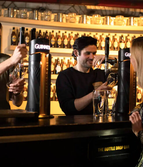 Guests enjoying drinks at the lively bar of Louis Fitzgerald Hotel, Dublin.