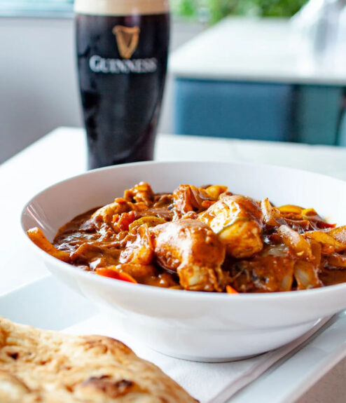 Delicious curry and naan with a pint of Guinness at Louis Fitzgerald Hotel's restaurant.