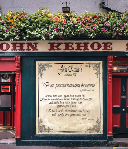 Historic pub with vibrant flowers in Dublin.