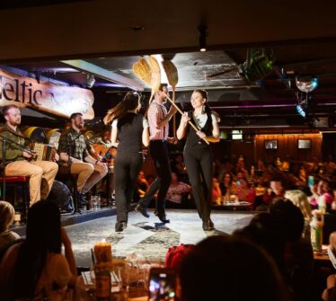 Lively Irish music and dance performance at Louis Fitzgerald Hotel pub.