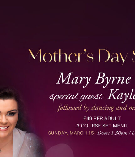 Two smiling women promoting Mother's Day Show with dining and live music at Louis Fitzgerald Hotel.