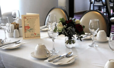 Elegant dining table set with flowers at Louis Fitzgerald Hotel Dublin.