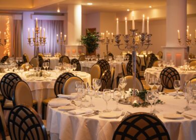 Elegant dining setup with candlelit tables at Louis Fitzgerald Hotel, Dublin.