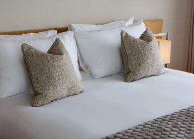 Luxurious bed with soft pillows at Louis Fitzgerald Hotel, Dublin.