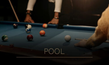 Guests enjoy a game of pool in a cosy, dimly lit room at Louis Fitzgerald Hotel, Dublin.