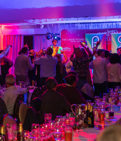 Guests enjoy lively entertainment at Louis Fitzgerald Hotel in Dublin.
