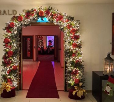 Festive archway with Christmas lights at Louis Fitzgerald Hotel entrance, Dublin.