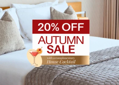 Elegant hotel room with cosy bedding and seasonal sale offer for autumn guests.