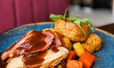 Savoury roast dinner with vegetables at the Louis Fitzgerald Hotel restaurant.